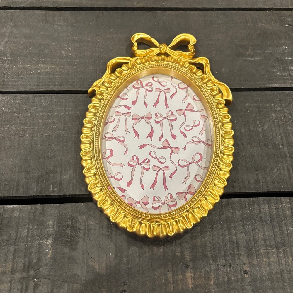 Gold Oval Picture Frame with Bow Design